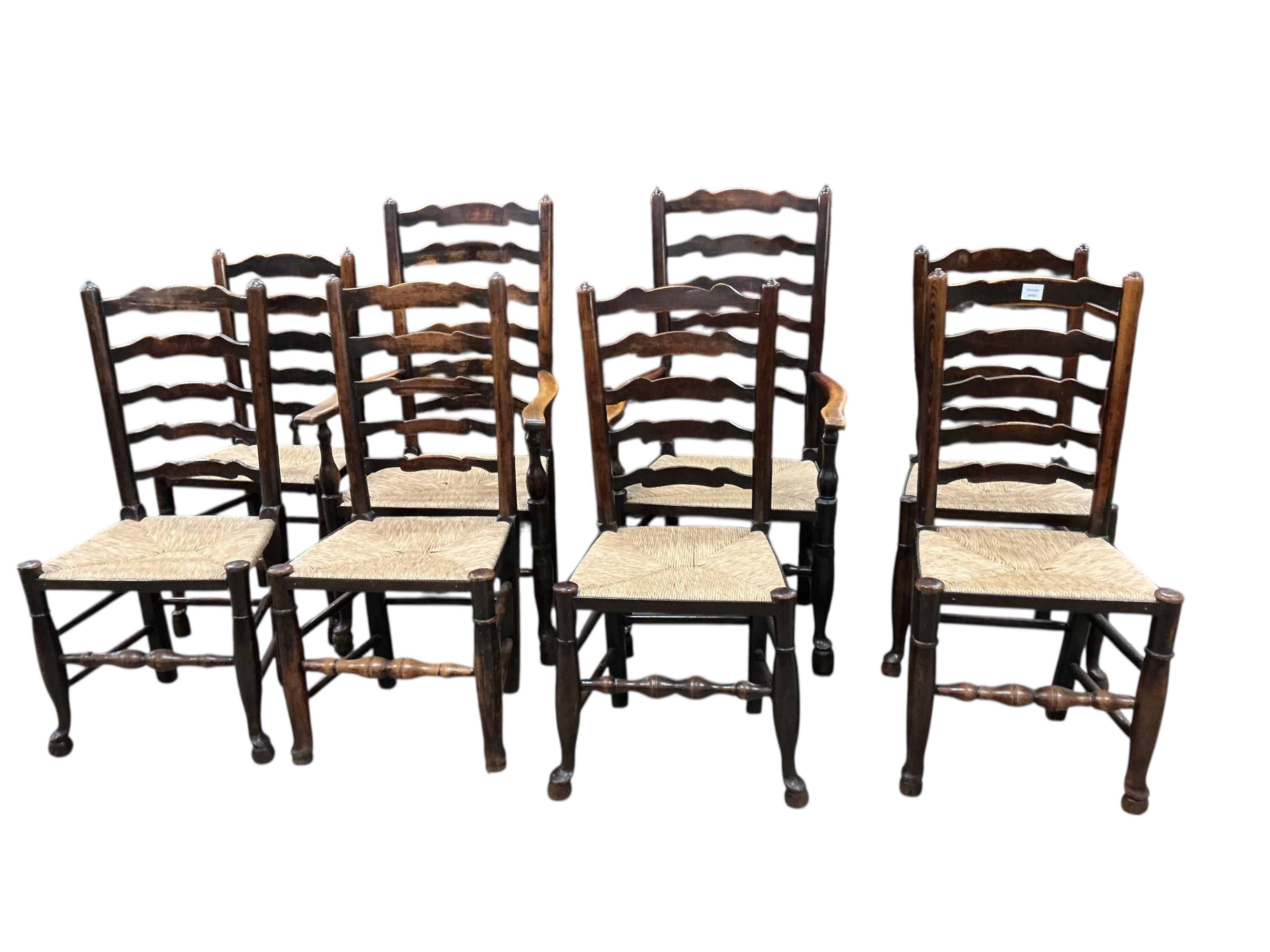 A set of eight 19th century Lancashire rush seat ash ladderback chairs, two with arms